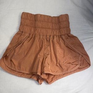 Looks like orange but is more of a pinkish orange color. Kind of like coral.